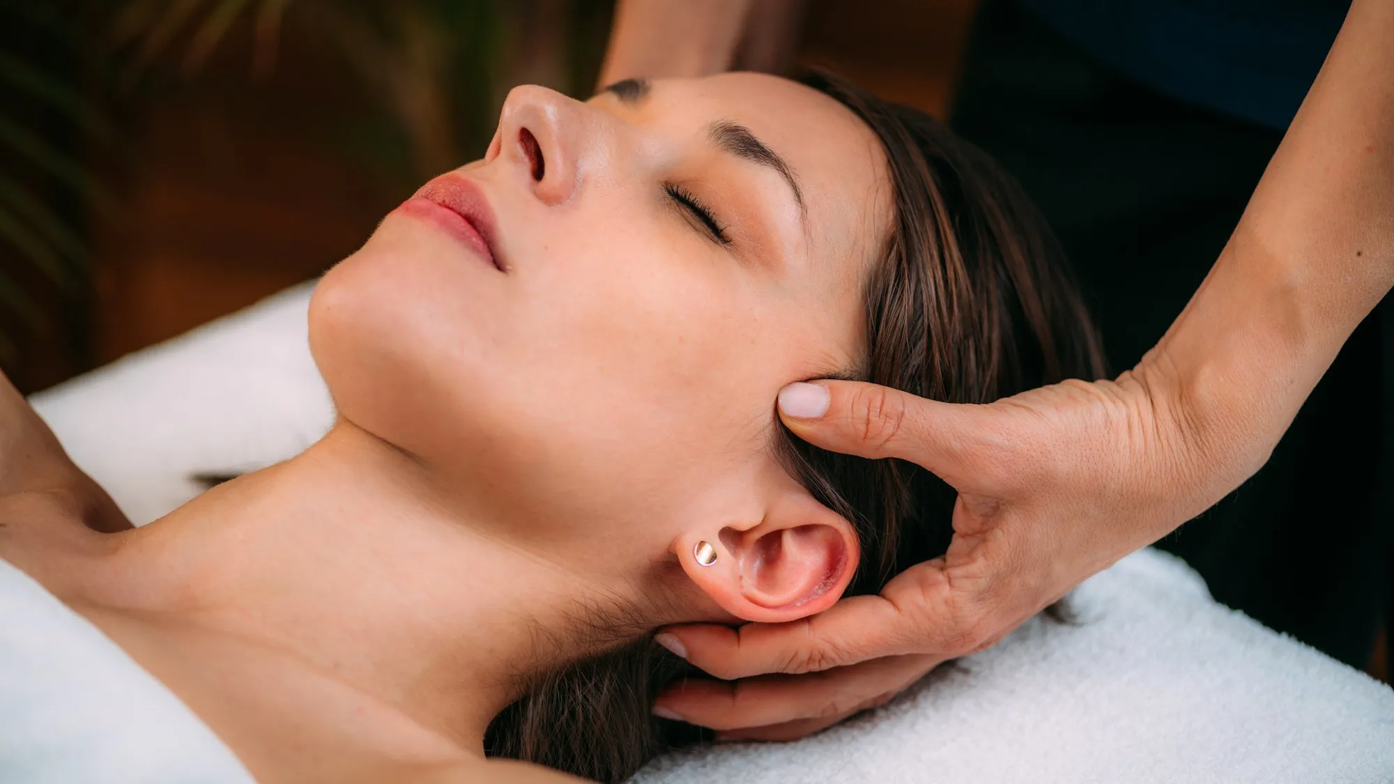 Scalp massage during a head spa session